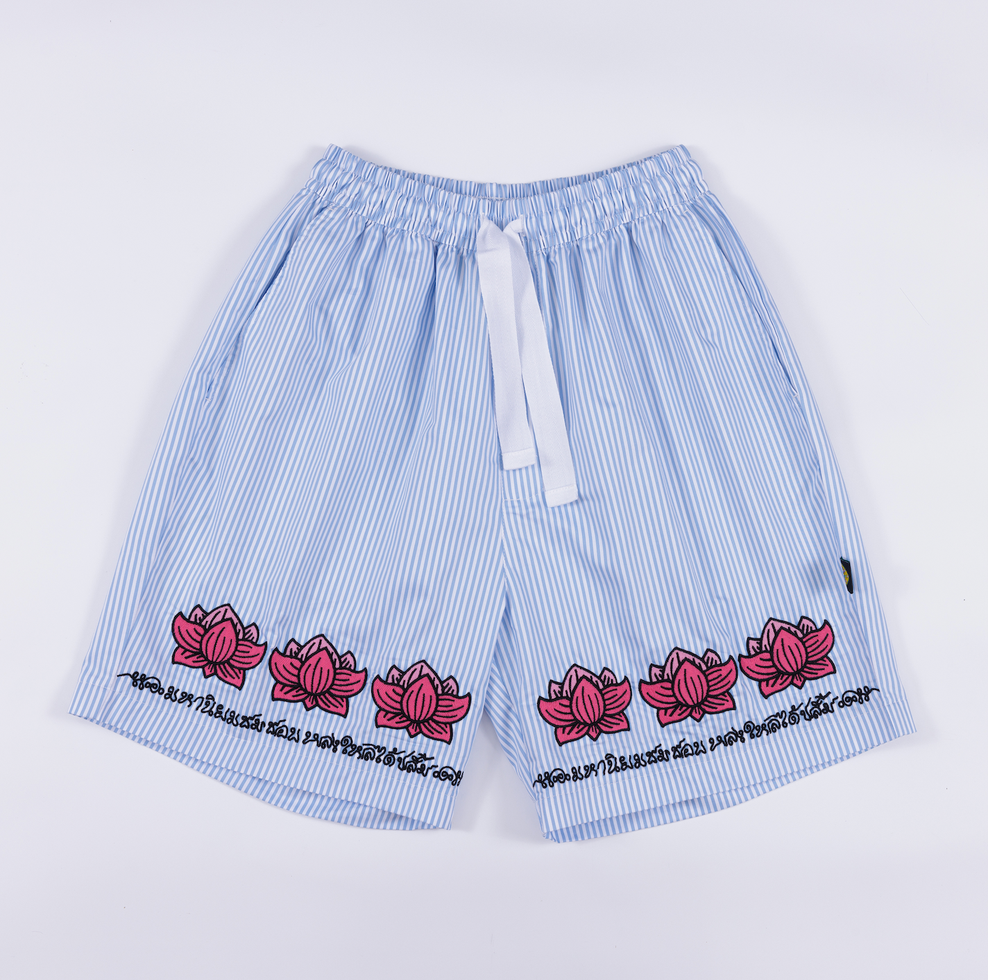 Shorts in striped cotton with lotus pattern embroidery